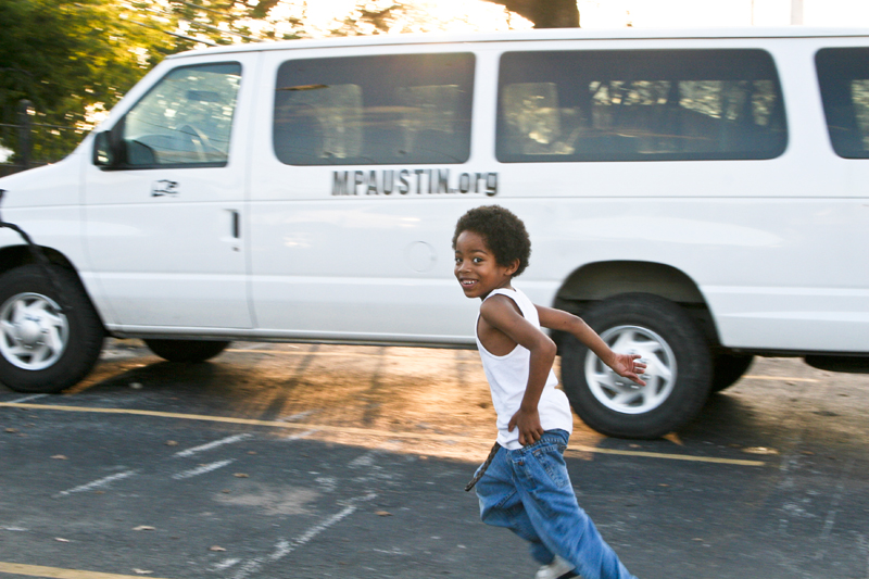 Deovion plays outside with other children and mentors.
