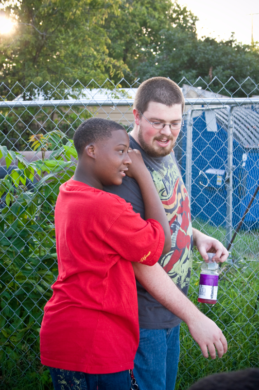 Ben Lowe thanks JaQuon for helping to clean up. Mentors said they often learn as much from the kids as the kids learn from them.