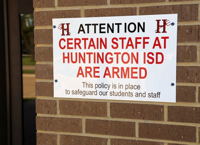 The Huntington school district has posted signs noting that some staff are armed at buildings across the district, including this one in front of Huntington Middle School. Photo courtesy of Andy Adams and The Lufkin News.