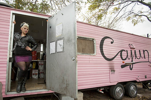 Lynzy Moran, owner and chef at Baton Creole, stands in her food truck located on East 6th St. in Austin. Photo by Gabriel Perez.