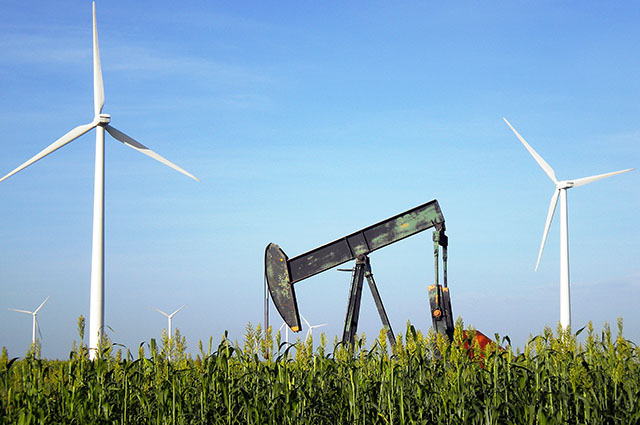 A pump jack coexists with wind turbines near Sweetwater. Photo courtesy of Sweetwater Economic Development.