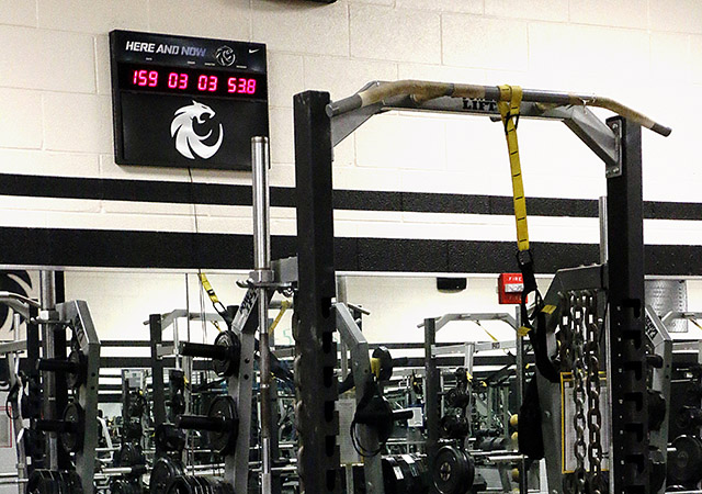 In the Denton Guyer High School field house a red digital clock serves as the reminder for the upcoming season. Photo by Arden Marie Pullig