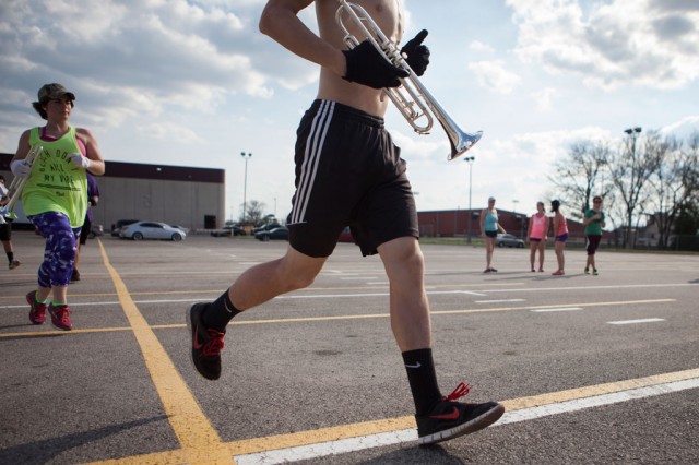 18.Members of the High Brass section of Genesis Drum and Bugle Corps run into position for marching practice during their weekend training camp on Saturday, March 14, 2014 in Bastrop, Texas. Photo by Skyler Wendler/Reporting Texas