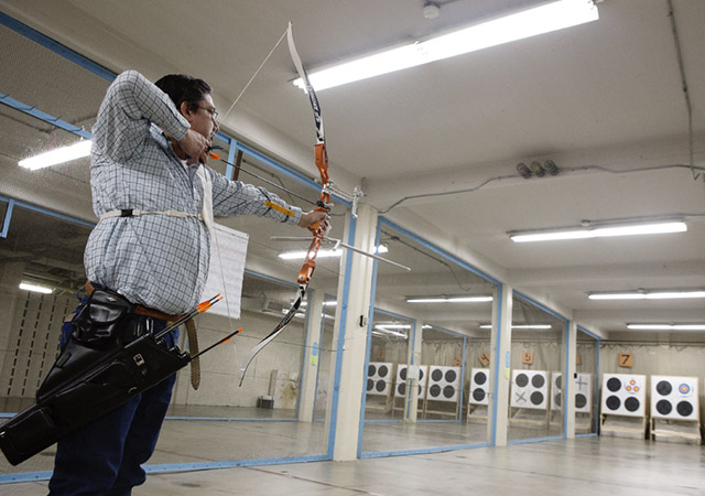 James Corral has spent much of the last 30 years — first as an archer, later as a volunteer head coach -- in the basement range used by the University of Texas at Austin club archery team. The team’s practice range is in the basement of Anna Hiss Gymnasium. Photo by Rocio Tueme