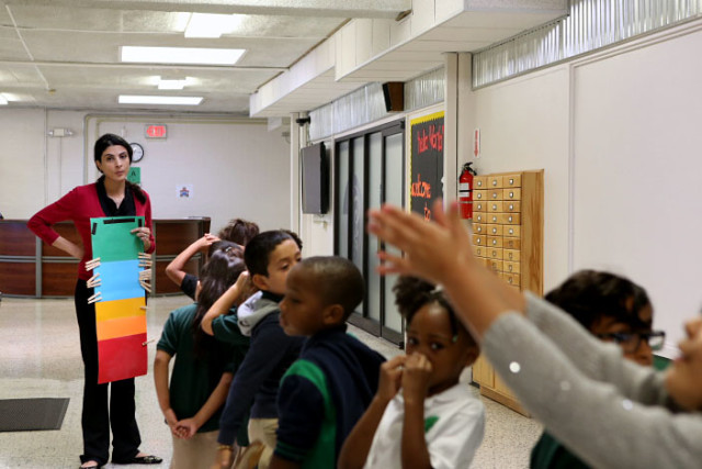 Ms. Mechkene lines up her kindergarten class for a bathroom break at the Arabic Immersion Magnet School in Houston. Thalia Juarez/Reporting Texas
