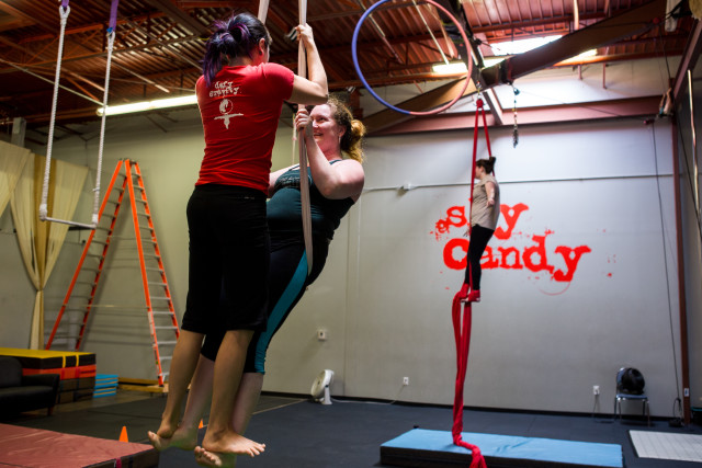 Winnie Hsia (left) practices aerial acrobatics with another student at the Sky Candy studio in downtown Austin, TX on November 21, 2015. Cori Baker/REPORTING TEXAS