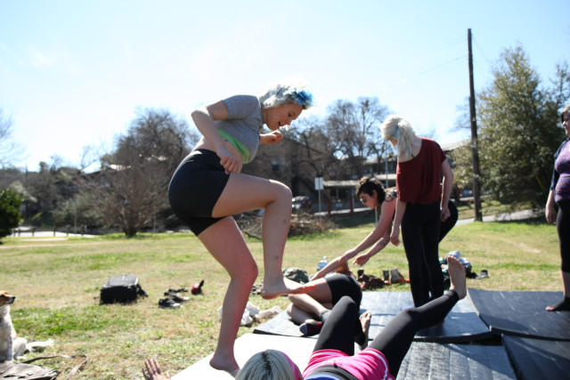 Shelby Bohannon practices kicking and stomping Jade White at Zilker Park in Austin during a wrestling practice on February 24, 2016.