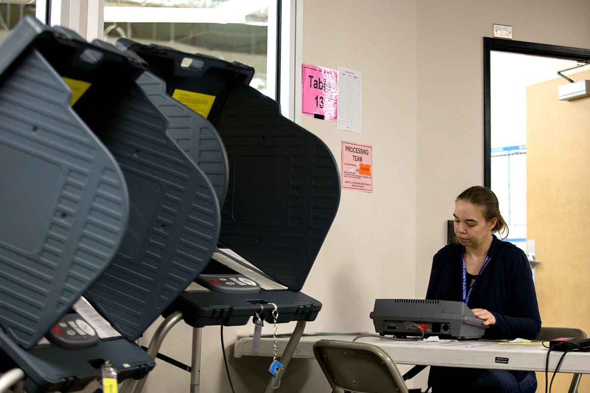 Meg Pettersson, the Training Lead at the Travis County Clerk Office, is inspecting the Voting Machines during a training session in Austin, TX, on Thursday October 13th, 2016. Photo by Meg Pettersson, the Training Lead at the Travis County Clerk Office, is inspecting the Voting Machines during a training session in Austin, TX, on Thursday October 13th, 2016. Christian Benavides for Reporting Texas