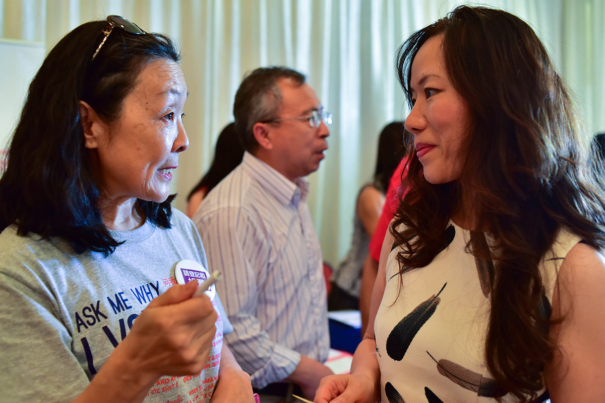 Alice Yi (left) speaks with Mei Zhou about registering Zhou to vote during a town hall meeting with Mayor Steve Adler on September 14, 2016. The event took place at the Chinese restaurant New Fortune on North Lamar Boulevard.