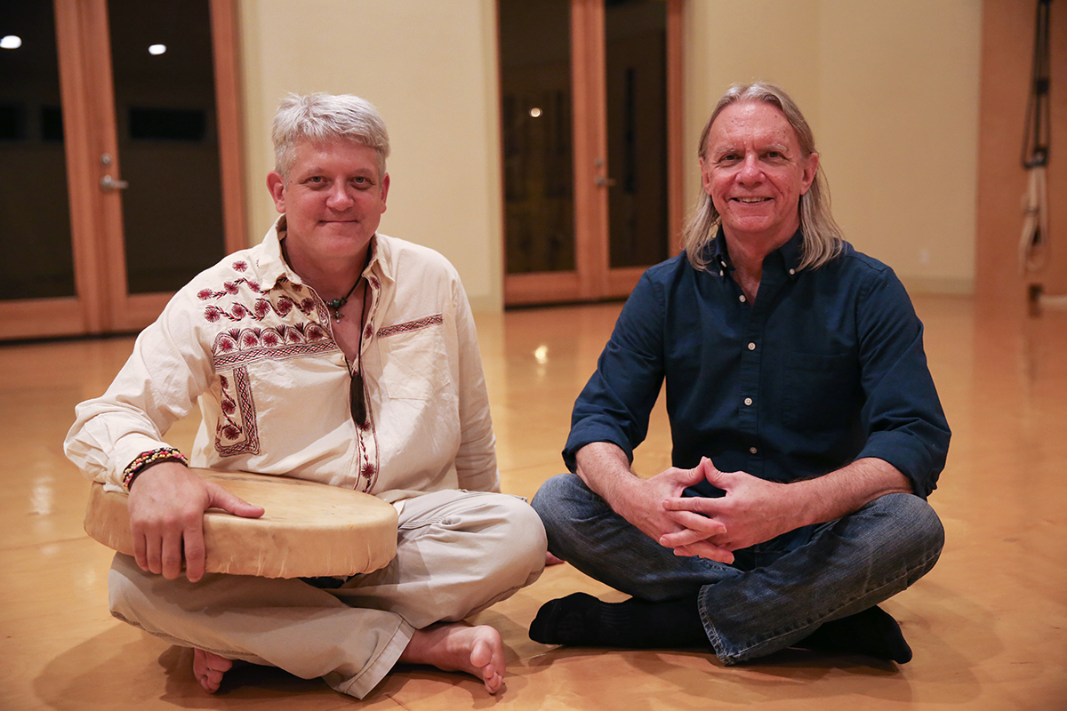Nate Long (left) and Gerry Starnes (right) took a rest after a journey session on a Wednesday night in a yoga studio in Southwest Austin.