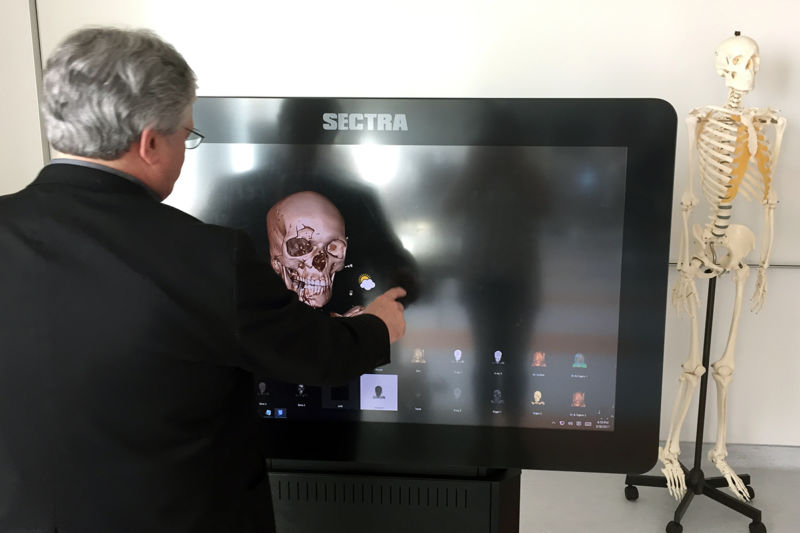Dr. Bill Miller interacts with the touch screen of the Sentra Table in the anatomy lab of the Dell Medical School. Costing more than $110,000, the Sentra table was originally designed to aid doctors in surgical planning. This technology allows students to study and manipulate 3-D rendering of the images of the cadaver bodies along with X-ray and CT scans. Danielle Smith / Reporting Texas